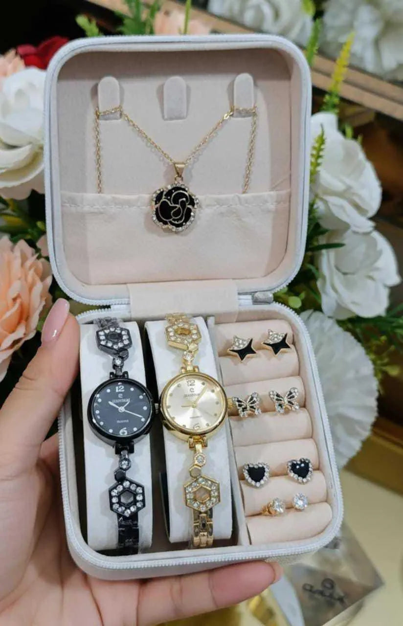 Luxury jewelry set featuring black and gold wristwatches, black star, butterfly, and heart earrings, and a gold chain necklace with black pendant in white case